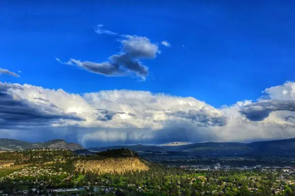 A serene mountain valley representing the clarity and depth available through guided psilocybin retreat experiences